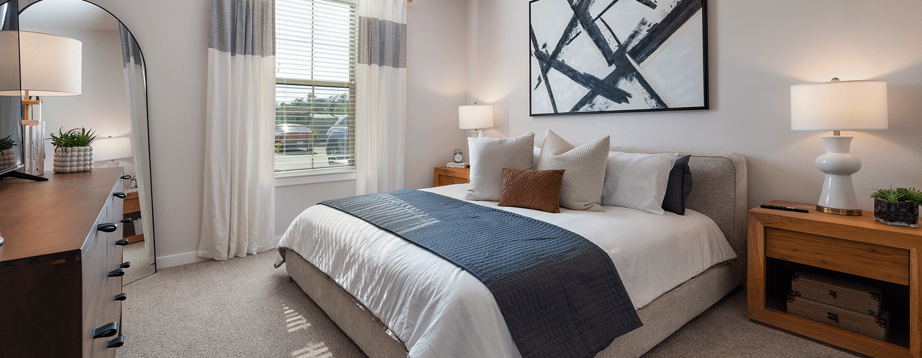 large open room with bed & furniture