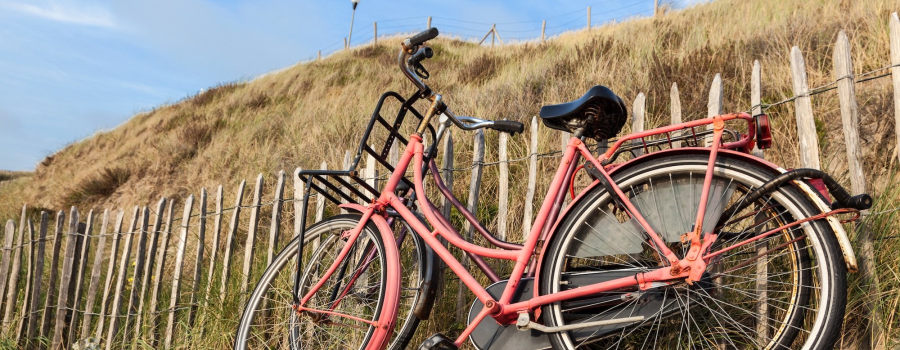 a bike next to a fence